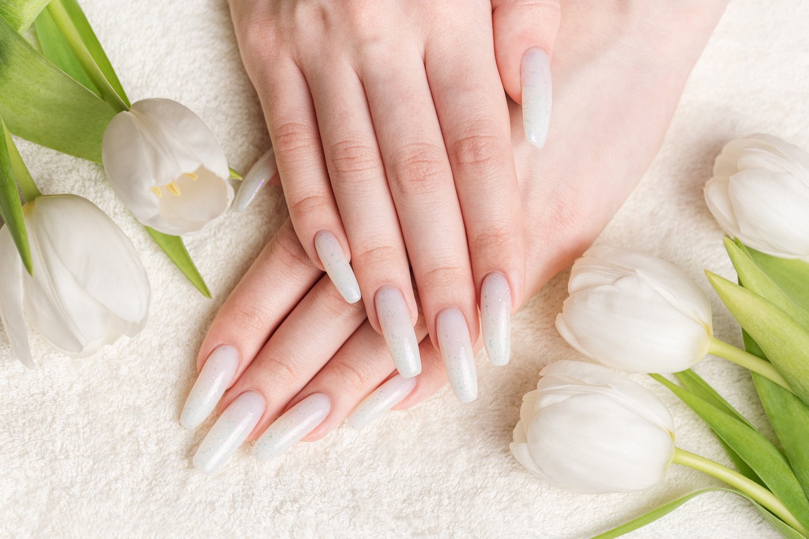 Female hand with spring nail design.